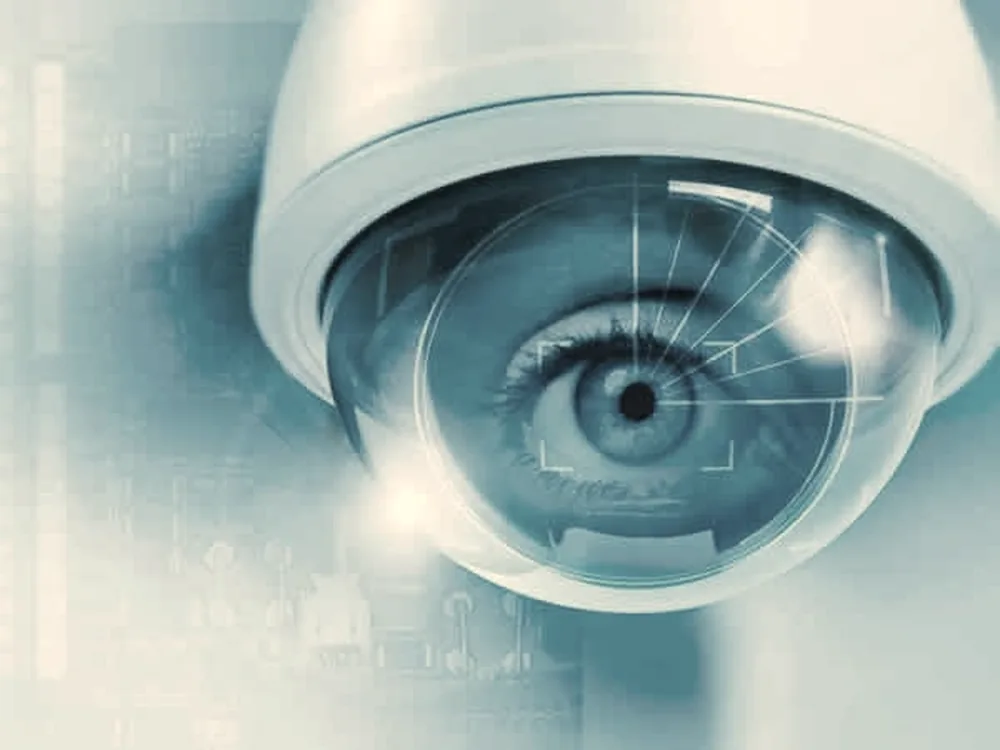 Dome camera watched over a wet road