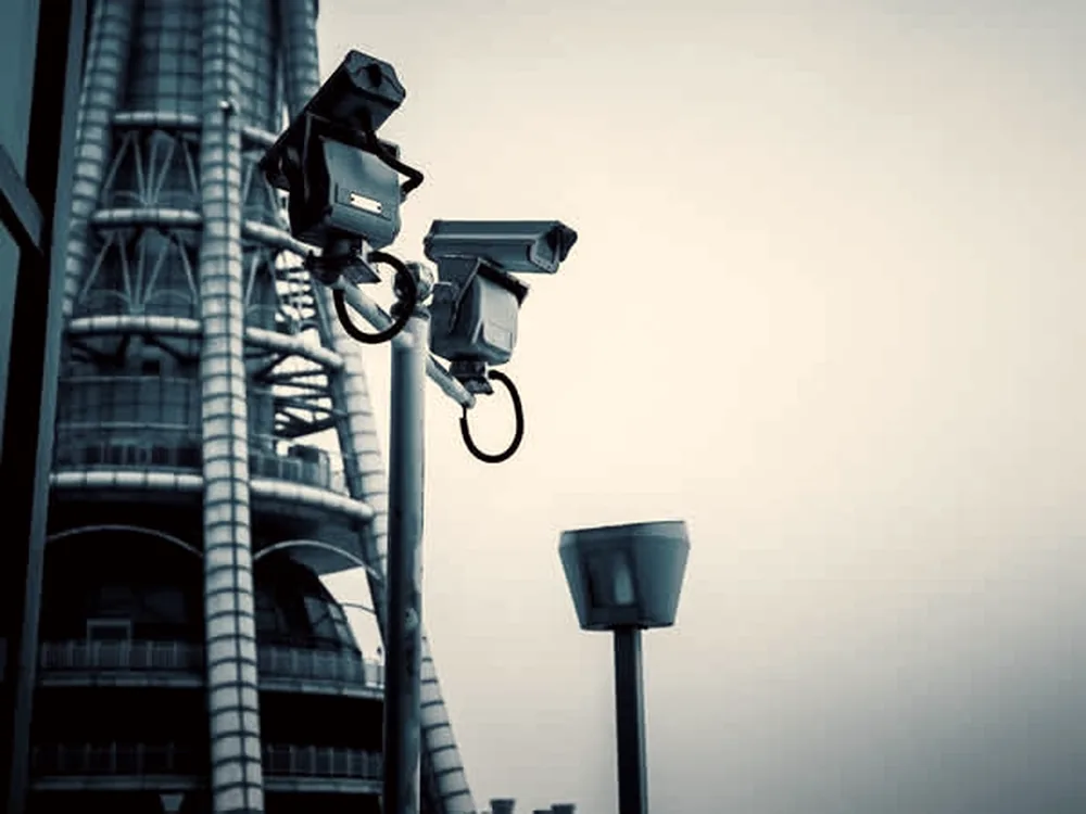 Several cameras mounted on a steel lattice tower